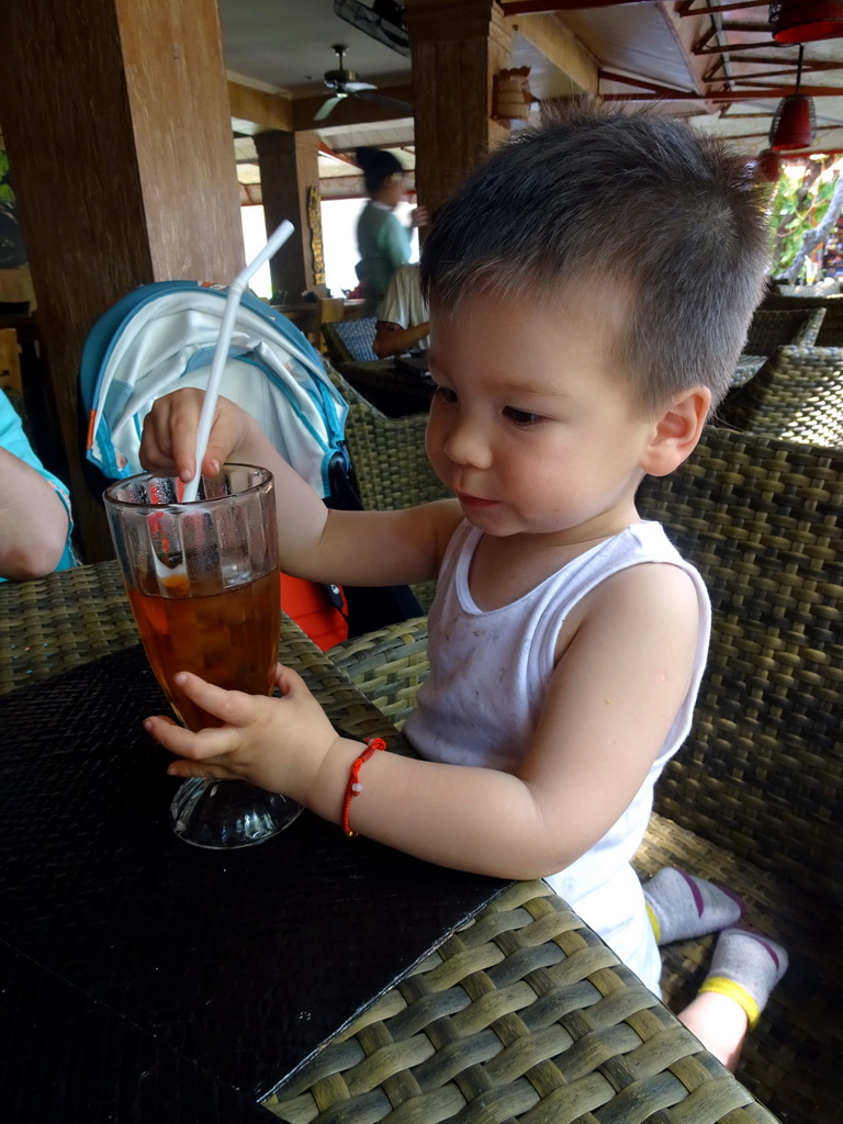 Max drinking an ice tea at the Bebek Tepi Sawah restaurant at the Bali Collection shopping mall