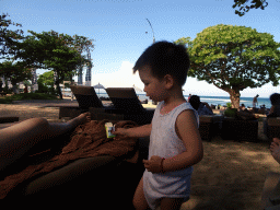 Max at the beach of the Inaya Putri Bali hotel