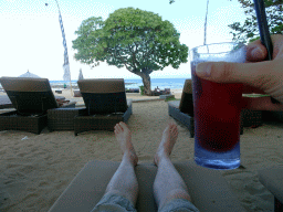 Tim with a drink at the beach of the Inaya Putri Bali hotel