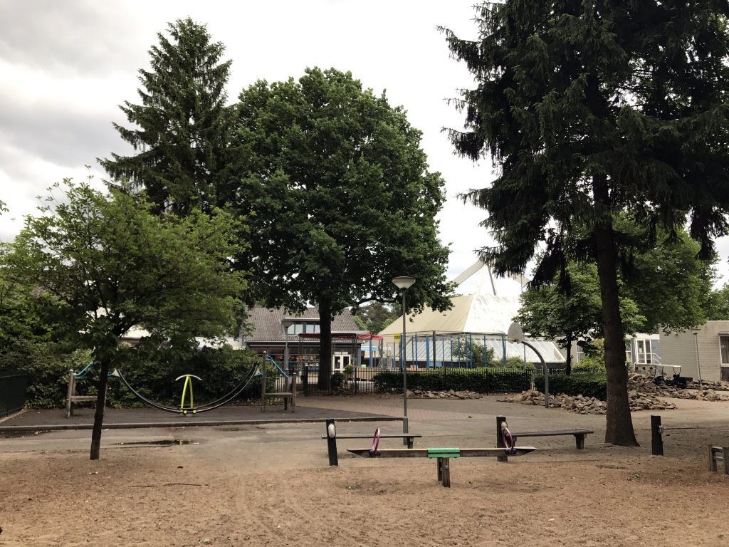 The central playground and the front of the supermarket of the Roompot De Katjeskelder holiday park