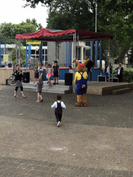 Max and the mascot Koos Konijn at the stage at the central square of the Roompot De Katjeskelder holiday park