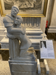 Statue `Saint Francis with a Leper` at the Oudenbosch Basilica, with explanation