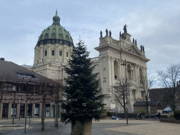 Christmas tree at the Jan Gielenplein square and the southwest side of the Oudenbosch Basilica