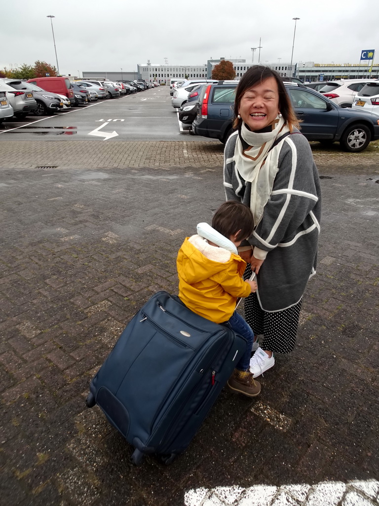 Miaomiao and Max at the parking lot of the Rotterdam The Hague Airport