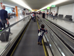 Max with his toy bunny on a walkway at the Palma de Mallorca Airport