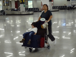 Miaomiao and Max on a luggage cart at the Palma de Mallorca Airport