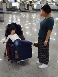 Miaomiao and Max on a luggage cart at the Palma de Mallorca Airport