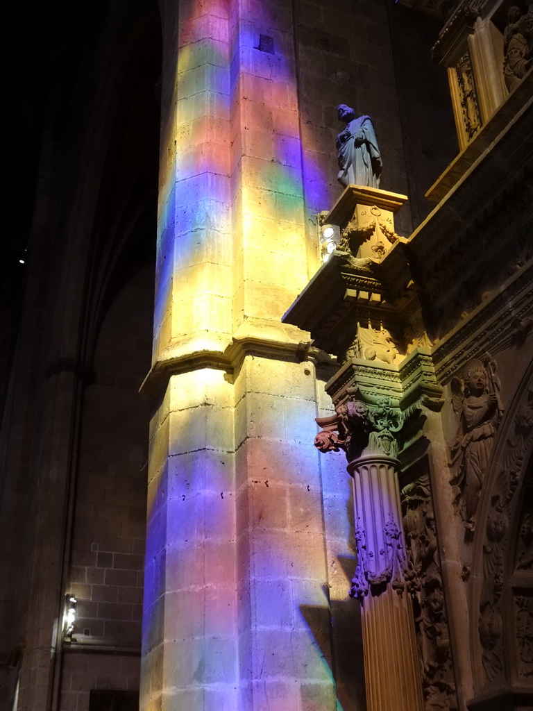 Coloured light at the left top part of the gate to the Atrium of the Vermells` Sacristy at the Palma Cathedral