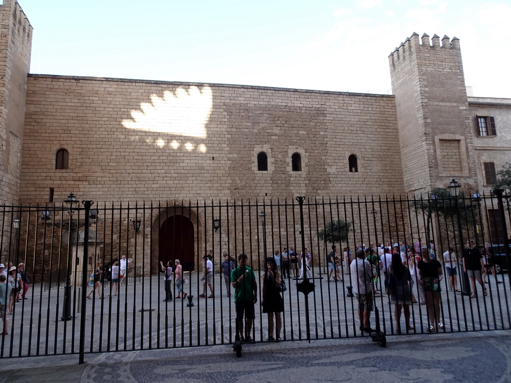 The east entrance to the Royal Palace of La Almudaina at the Carrer del Palau Reial street, viewed through the Great Portal at the west side of the Palma Cathedral