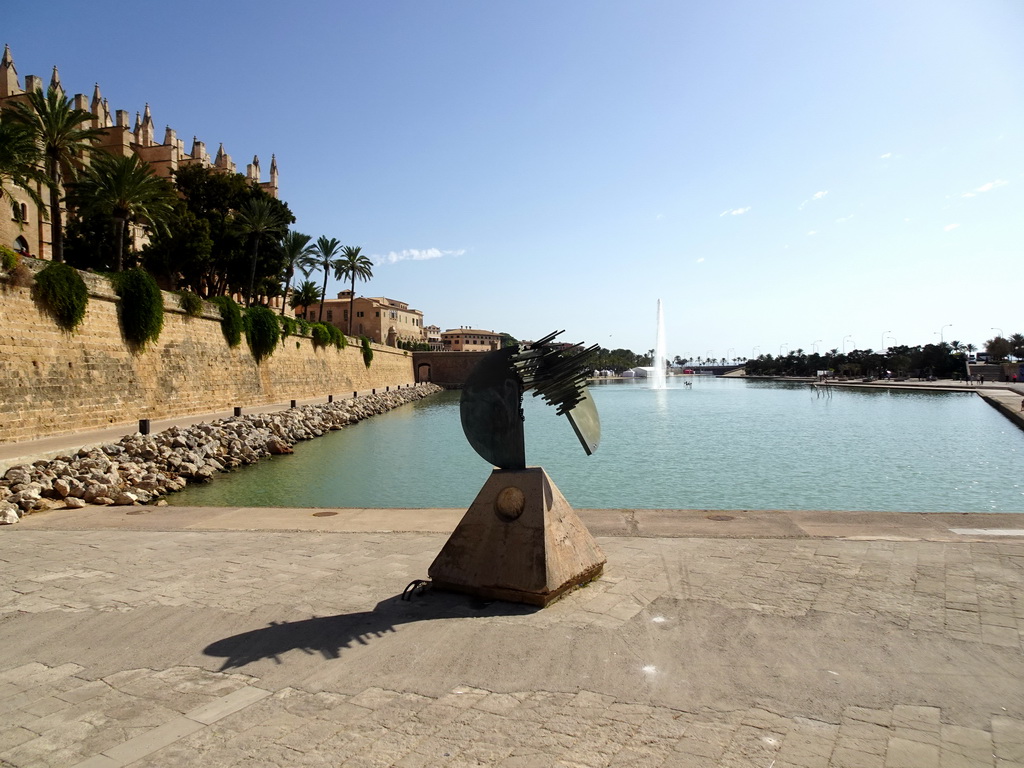 Piece of art and the fountain at the west side of the Parc de la Mar, viewed from the Passeig Dalt Murada street