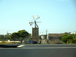 Windmill at the El Molinar neighbourhood, viewed from the rental car on the Ma-19 road