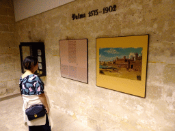 Miaomiao with a painting and information on the city of Palma from 1575 to 1902, at the museum at the first floor of the Castell de Bellver castle