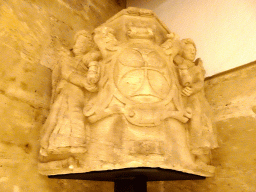 Corner capital with shield of the trinitarian cross supported by tenant angels, at the museum at the first floor of the Castell de Bellver castle