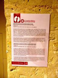 Explanation on the corner capital with shield of the trinitarian cross supported by tenant angels, at the museum at the first floor of the Castell de Bellver castle