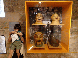 Miaomiao and Max with Capgrossos masks, at the museum at the first floor of the Castell de Bellver castle, with explanation