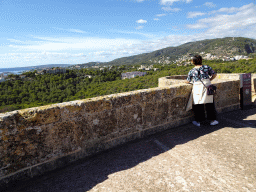Miaomiao at the roof of the Castell de Bellver castle, with a view on the hills and houses on the west side