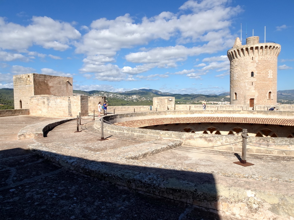 The roof, the west tower and the main tower of the Castell de Bellver castle, viewed from the southeast side