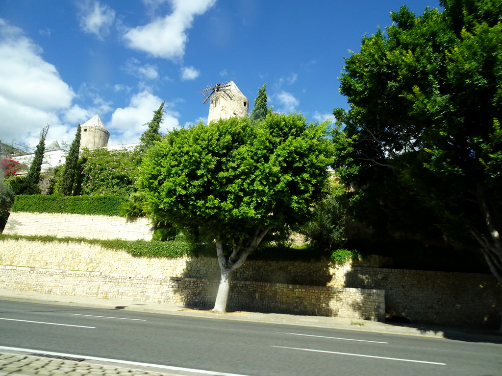 Windmills at the Carrer dels Gambins street, viewed from the rental car on the Avinguda de Gabriel Roca street