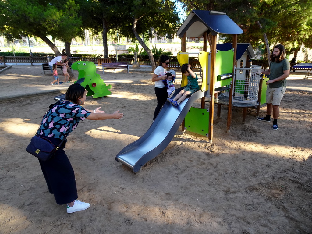 Miaomiao and Max on the slide at the playground at the Parc de Sa Feixina