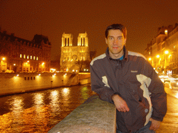 Tim with the Cathedral Notre Dame de Paris and the river Seine, by night