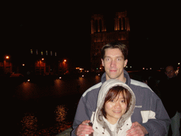 Tim and Miaomiao with the Cathedral Notre Dame de Paris and the river Seine, by night