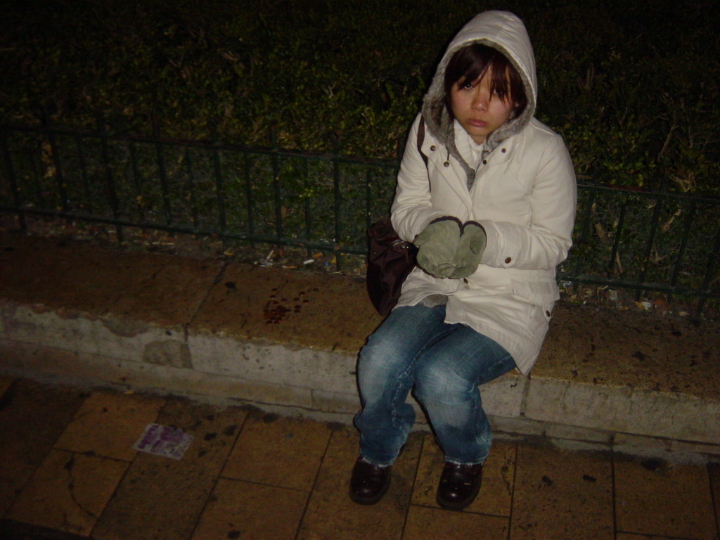 Miaomiao playing a beggar on the streets of Paris, by night