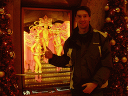 Tim at a photo near the entrance of the Moulin Rouge, by night