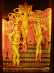 A photo near the entrance of the Moulin Rouge, by night