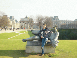 Tim with a statue in the Tuileries Garden, and the Arc de Triomphe du Carousel in front of the Louvre Museum