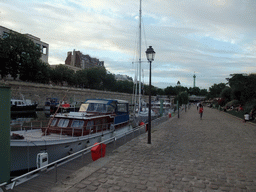 Boats in the Bassin de l`Arsenal basin and the Colonne de Juillet column