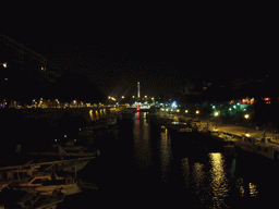 Boats in the Bassin de l`Arsenal basin and the Colonne de Juillet column, by night