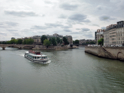 Boat in the Seine river, with the Île de la Cité and Île Saint-Louis islands, and the Pont Louis-Philippe and Pont Saint-Louis bridges