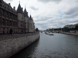The Conciergerie and the Pont Neuf bridge over the Seine river, viewed from the Pont au Change bridge