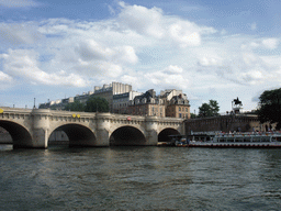 The Pont Neuf bridge over the Seine river and the statue of King Henry IV, viewed from the Seine ferry
