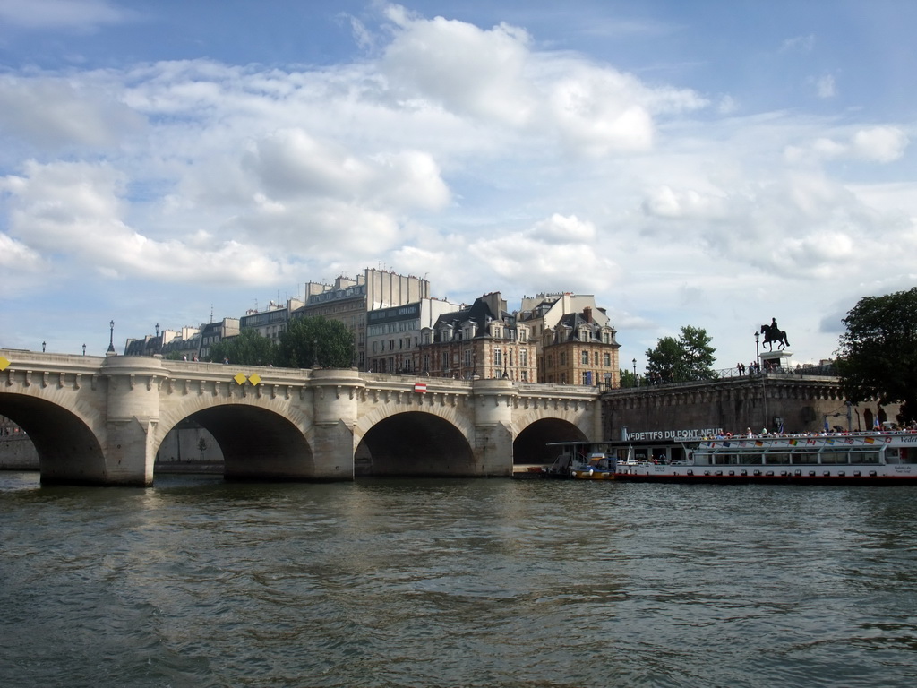 The Pont Neuf bridge over the Seine river and the statue of King Henry IV, viewed from the Seine ferry