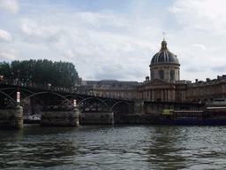 The Pont des Arts bridge over the Seine river and the Institut de France in the Collège des Quatre Nations, viewed from the Seine ferry