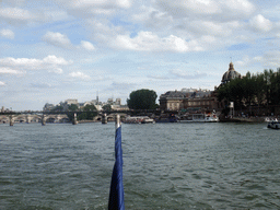 The Pont des Arts bridge and the Pont Neuf bridge over the Seine river, and the Institut de France in the Collège des Quatre Nations, viewed from the Seine ferry