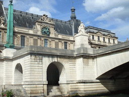 The Pont du Carousel bridge over the Seine river and the south side of the Louvre Museum, viewed from the Seine ferry