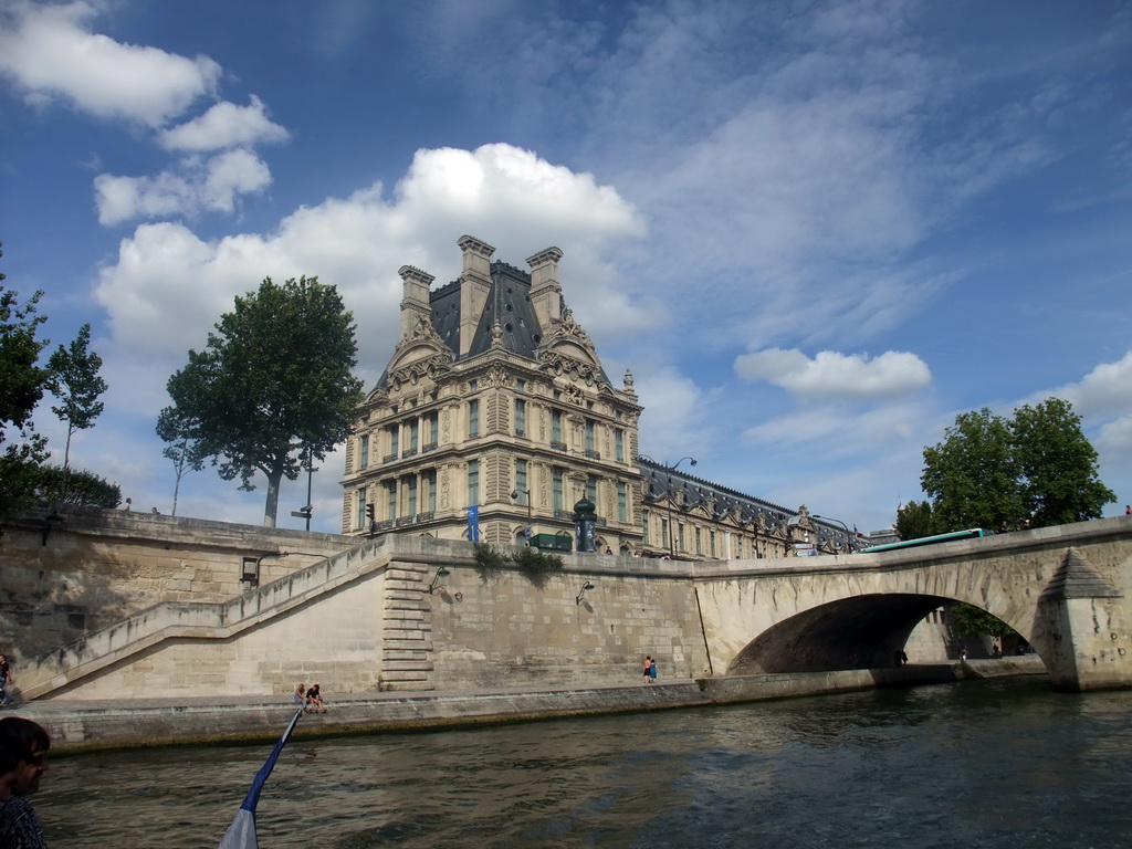 The Pont Royal bridge over the Seine river and the Pavillon de Flore of the Louvre Museum, viewed from the Seine ferry