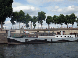 Boat in the Seine river and the Obelisk of Luxor at the Place de la Concorde square, viewed from the Seine ferry
