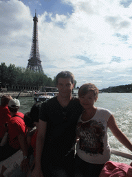 Tim and Miaomiao at the Eiffel Tower, viewed from the Seine ferry