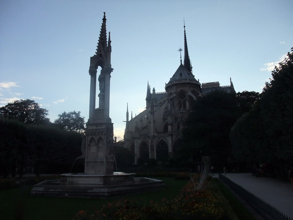 Fountain of the Virgin in the Square Jean XXIII and the back side of the Cathedral Notre Dame de Paris