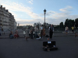 Street artists on the Pont Saint-Louis bridge