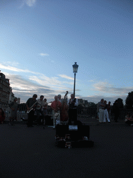 Street artists on the Pont Saint-Louis bridge