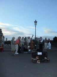 Street artists on the Pont Saint-Louis bridge