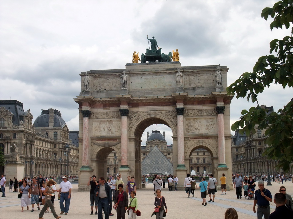 The Arc de Triomphe du Carousel, the Louvre Pyramid at the Cour Napoleon courtyard, and the Louvre Museum