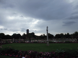 The east side and the central pool of the Jardin du Luxembourg park, and the Tour Montparnasse tower