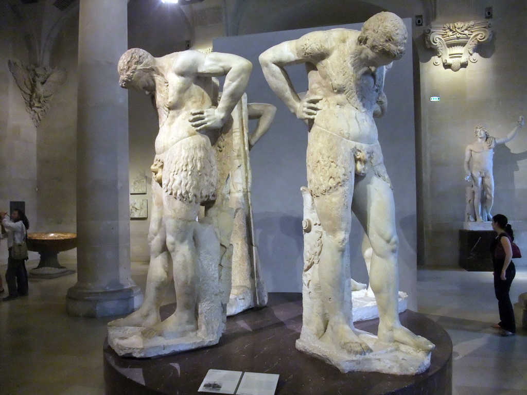 Statues `Satyres de Atlante` in the Salle du Manège room on the Ground Floor of the Denon Wing of the Louvre Museum