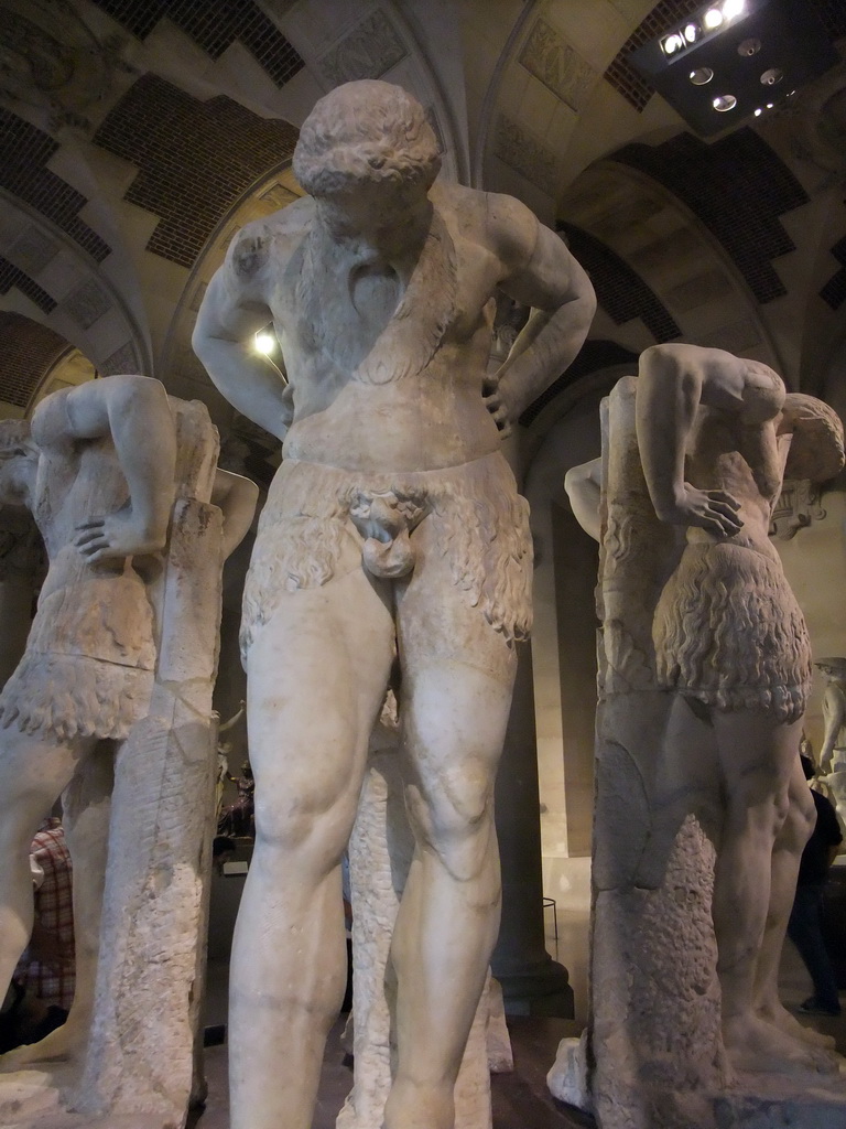 Statues `Satyres de Atlante` in the Salle du Manège room on the Ground Floor of the Denon Wing of the Louvre Museum