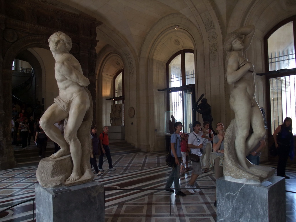 Statues `The Rebellious Slave` and `The Dying Slave` by Michelangelo, in the Galerie Mollien (Michelangelo Gallery) on the Ground Floor of the Denon Wing of the Louvre Museum